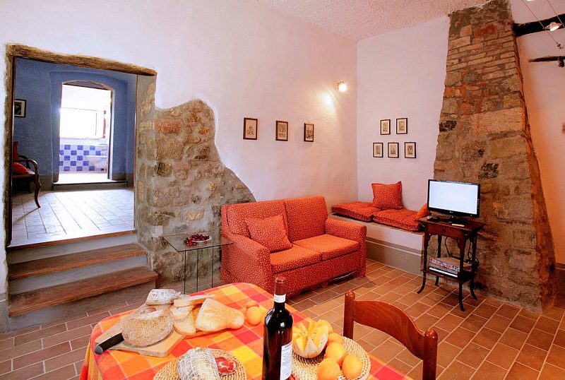 Three steps lead up from the kitchen-dining-living room to the bathroom & bedroom of Apartment A.