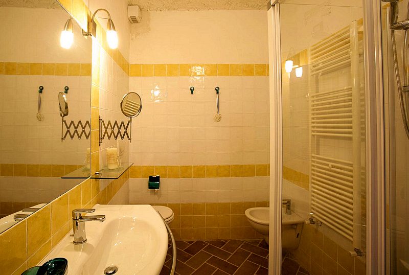 Apartment B's bathroom has a shower.