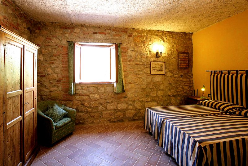 Apartment B — Bedroom 2 is also classically Tuscan.