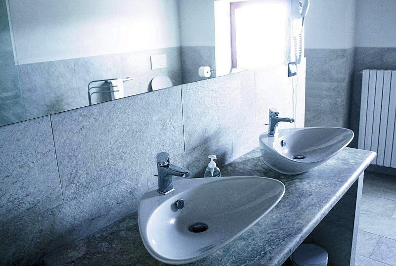 Apartment C - bathroom #2 with twin basins.