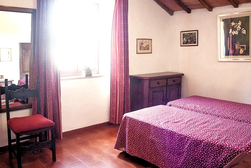 Apartment C's third bedroom has an open-beam ceiling.