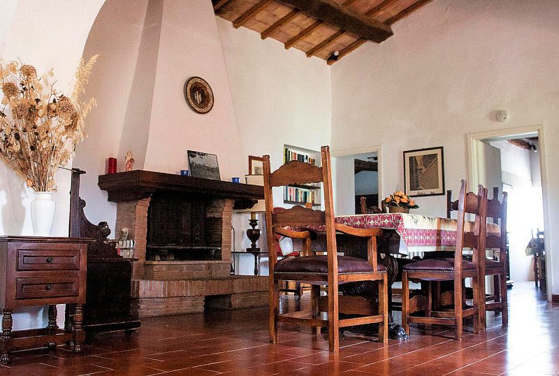 Elegant dining room with fireplace at Apartment C.