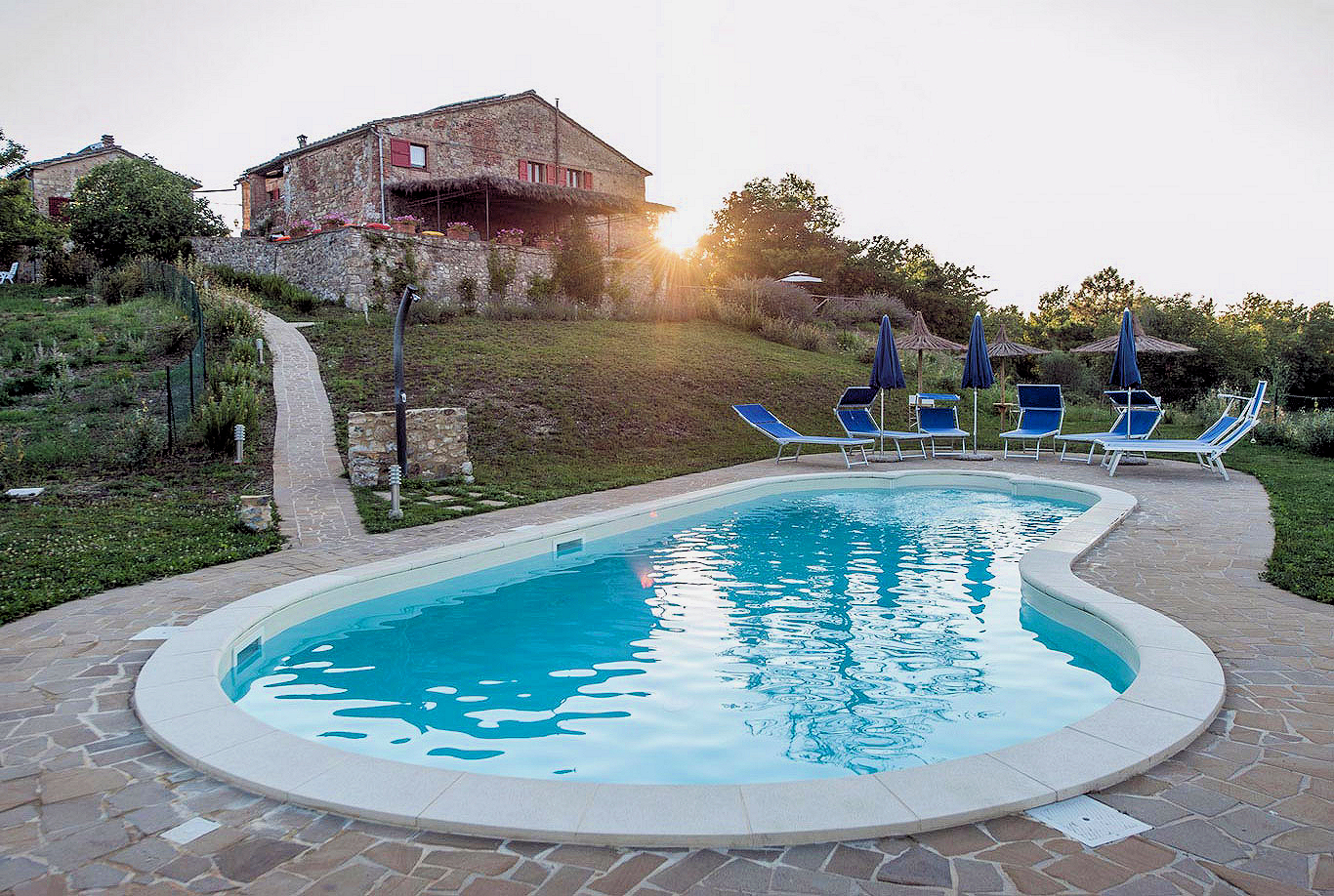 The estate's pool beckons guests during the heat of the Tuscan summer.