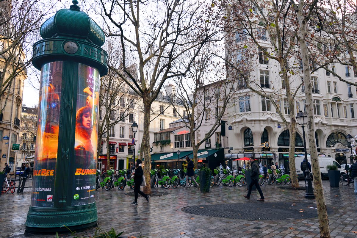 Traditional Morris column and rows of public Vélib' city bikes help Paris stay green.