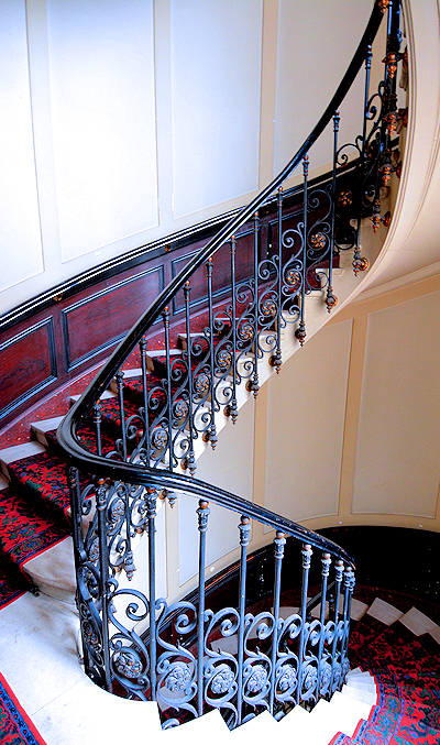 Although there is a lift to the 3rd floor apartment, descending the sweeping Haussmann staircase speaks to the apartment's elegant Parisian location.