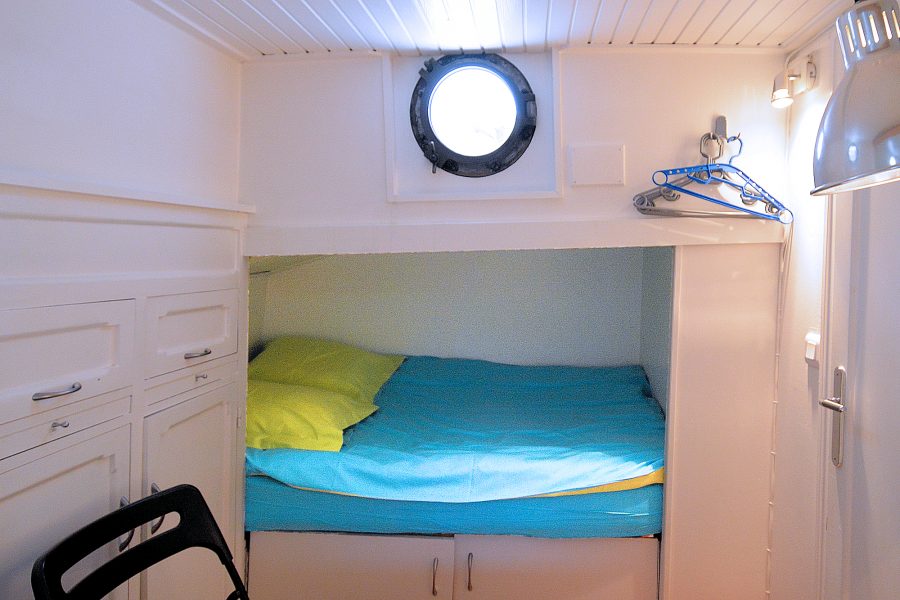 The double bed in Bedroom 2 is cleverly recessed into a shadowbox.