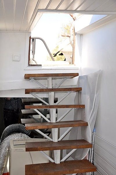The entry steps from the boat deck down into the apartment.