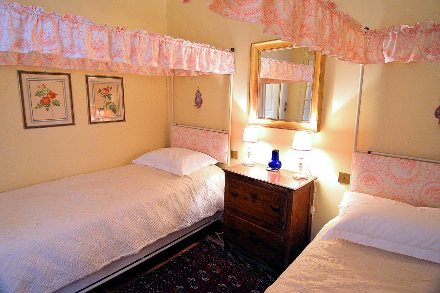 The second bedroom at the Place des Galeries apartment has twin beds.