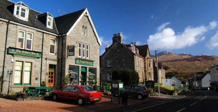 Main Street, Killin, with two of Scotland's highest mountain peaks in the background.