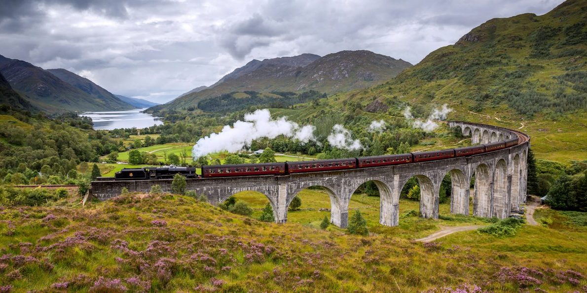 The Jacobite steam train crossing Glenfinnan Viaduct in the Highlands. Photo copyright VisitBritain-VisitScotland.