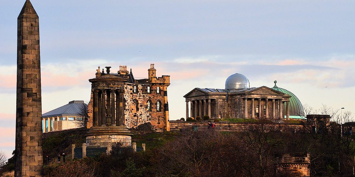 Edinburgh - Calton Hill Monuments from North Bridge - 131218-9272 - 2000x1073 72dpi - Photo copyright Home At First A collection of largely unrelated monuments occupies Edinburgh's Calton Hill on the east end of Princes Street.