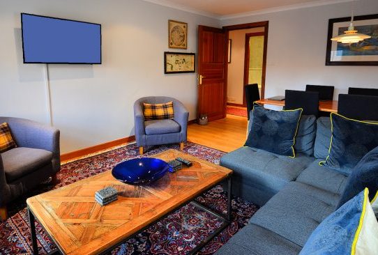 Edinburgh - Lodging - Heathers Penthouse Flat - Royal Mile - Living room - Photo copyright Home At First Edinburgh: Heather's Penthouse Flat — Living room with TV