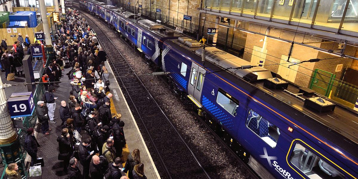 Edinburgh - ScotRail commuters waiting on Platform 19 - Photo copyright Home At First Edinburgh: commuters waiting for their train at Waverley Station.