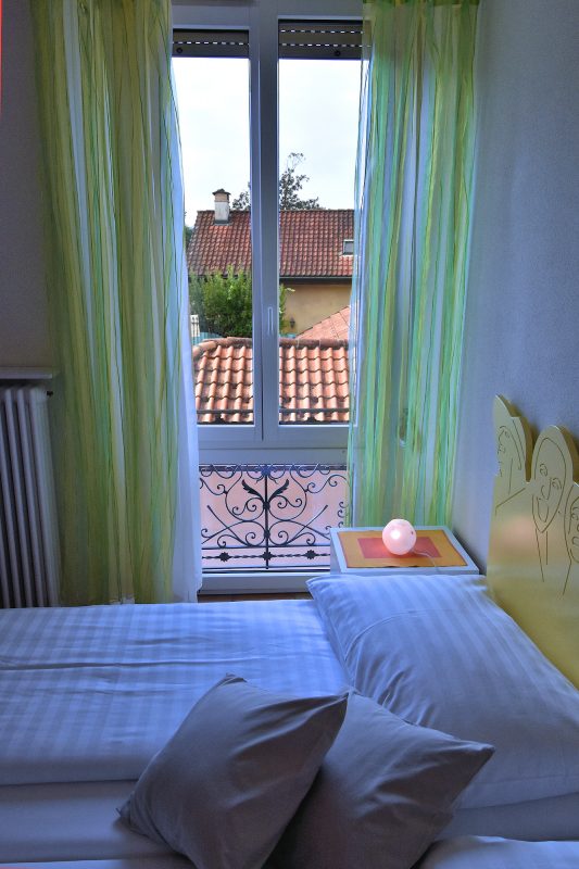 Home At First Città Vecchia 1-bedroom apartment — twin bedroom with view.