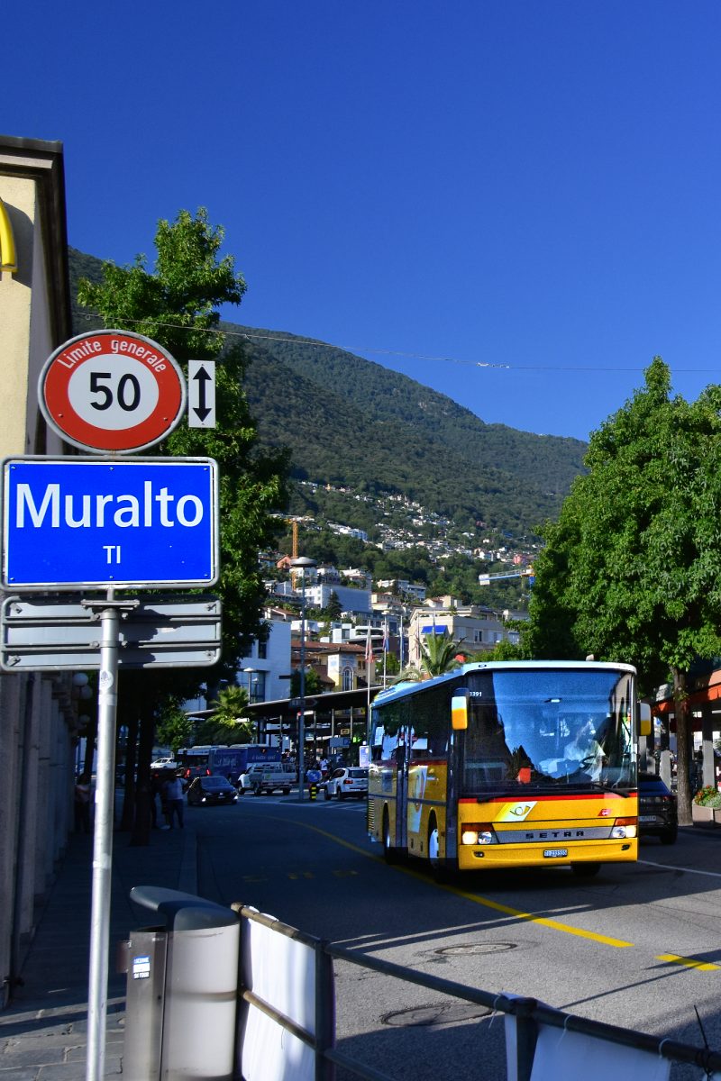 Swiss Post Bus departing Muralto's transport center.