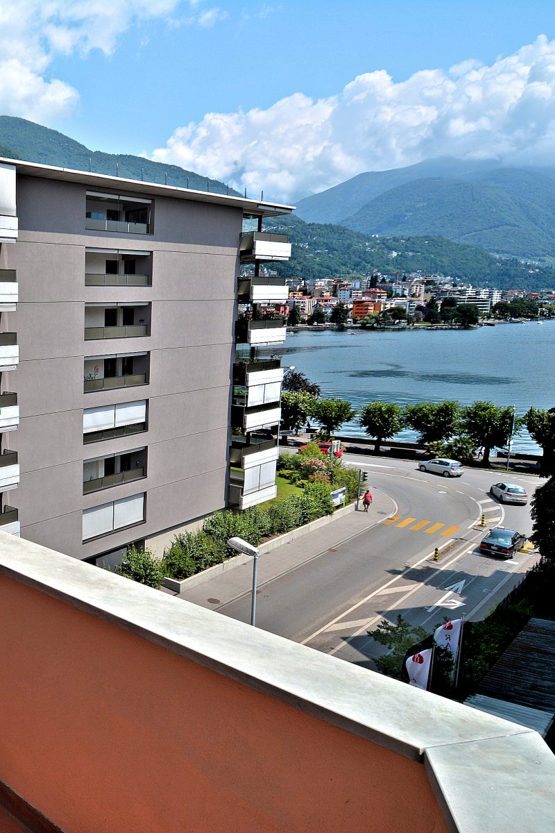 New Town - Balcony view over Locarno harbor and Muralto to the Verzasca Valley.