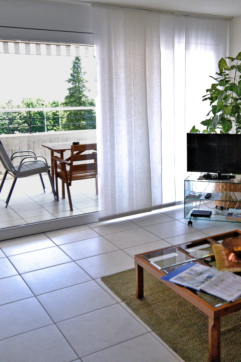 New Town - Plus Apartment living room & furnished balcony.