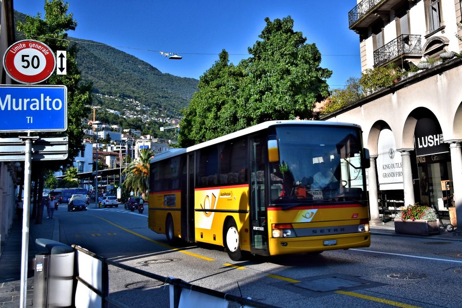 Ticino - Swiss postal bus departing Muralto and entering Locarno.