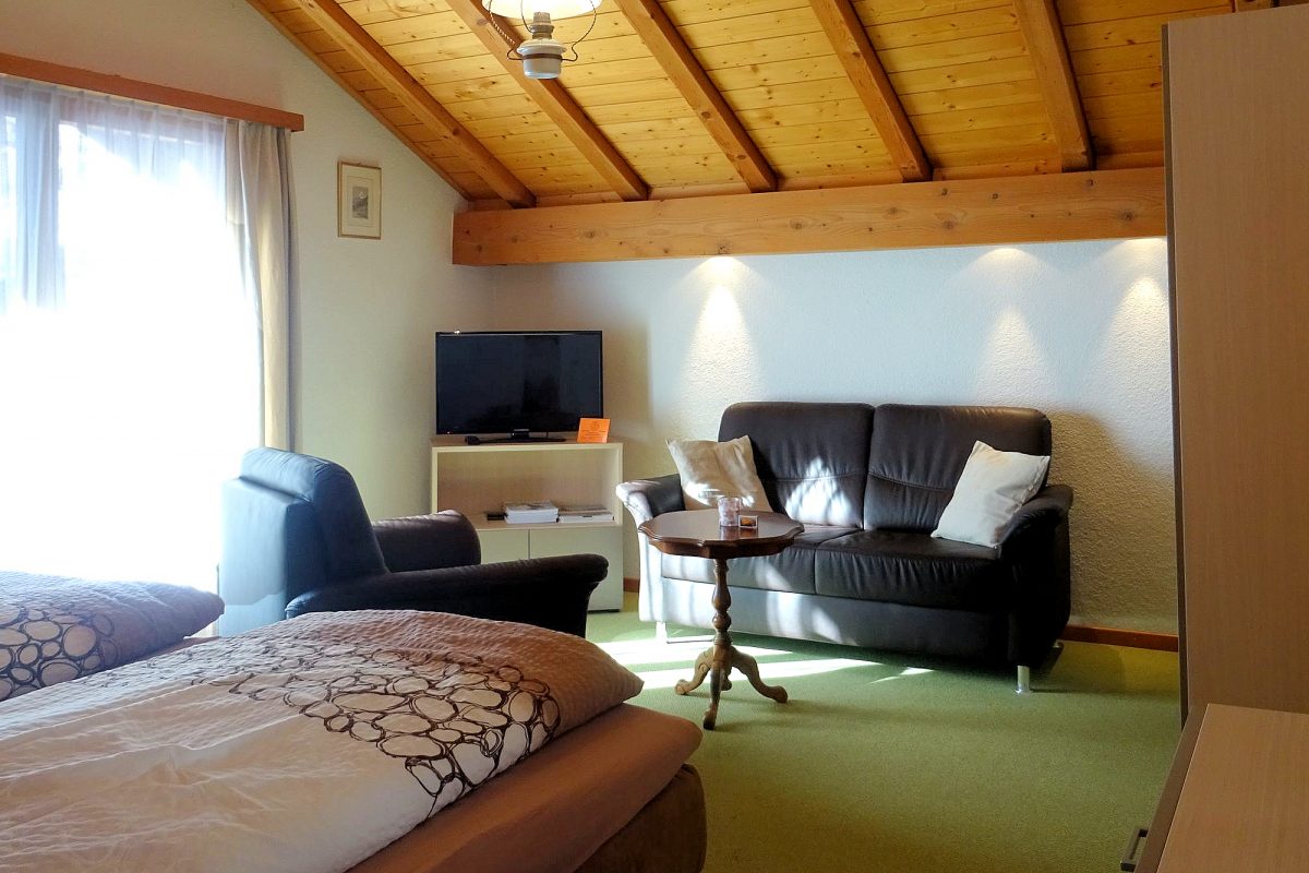 Chalet Barbara Studio — living and sleeping areas with balcony access.