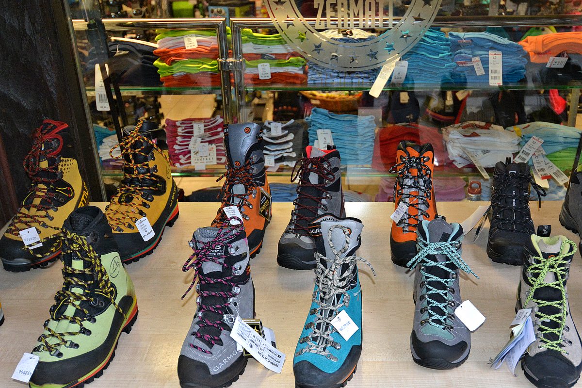 Colorful hiking boots in Zermatt sporting goods shop.