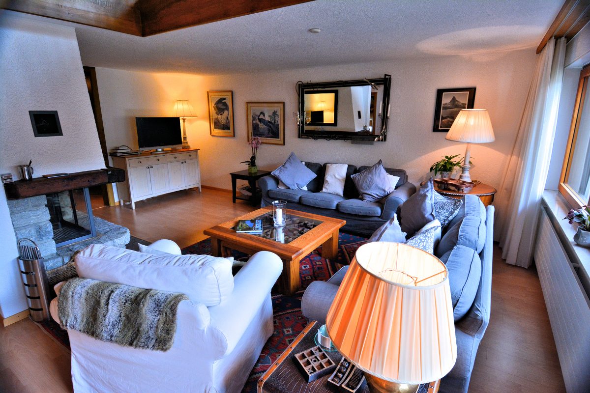 Lower Matten Maisonette - Living room with fireplace.