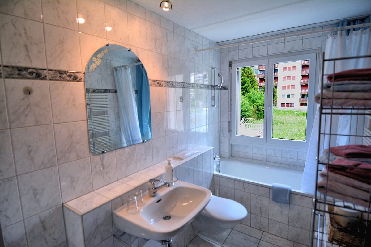 Riverview Apartment — Bathroom with tub/shower.