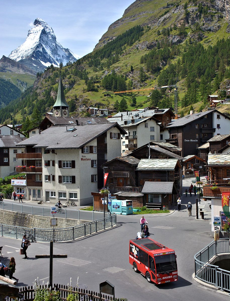Zermatt - Taxi at the Zum Steg Bridge with Old Town and Matterhorn.