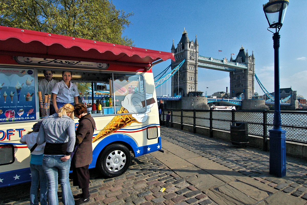 Ice lolly truck on the Tower of London's riverside promenade by Tower Bridge. Families love London.