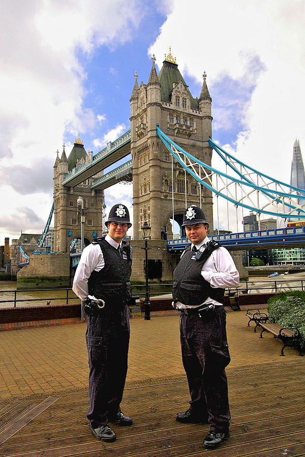 London's Finest - police constables on foot patrol at St. Katharine's Pier by Tower Bridge.