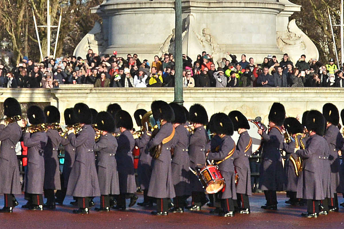 A military band assembles ranks for the daily 11AM Changing of the Guard at Buckingham Palace.