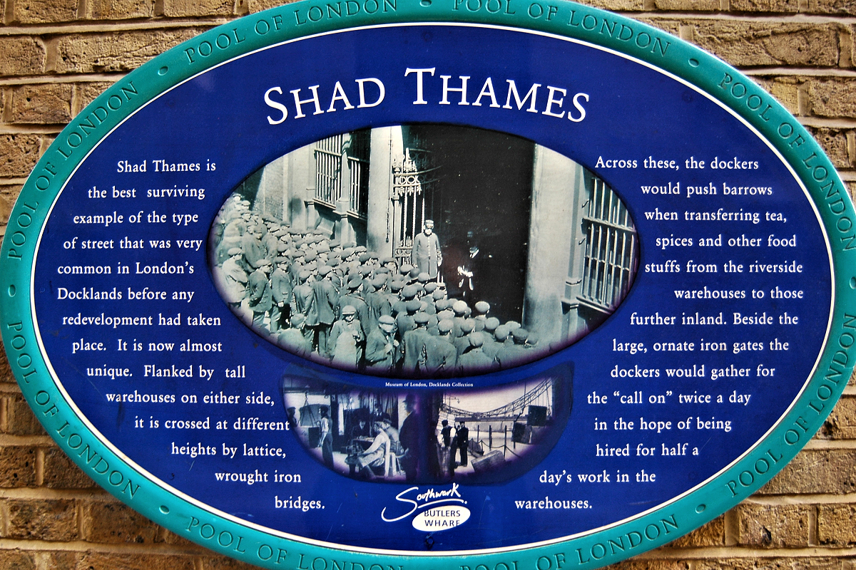 Shad Thames historic marker chronicling London's best-preserved old warehouse street.