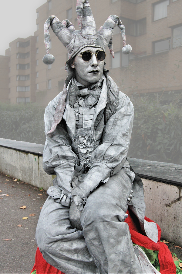 Man about Town: South Bank street performer as a live jester statue by Royal Festival Hall.