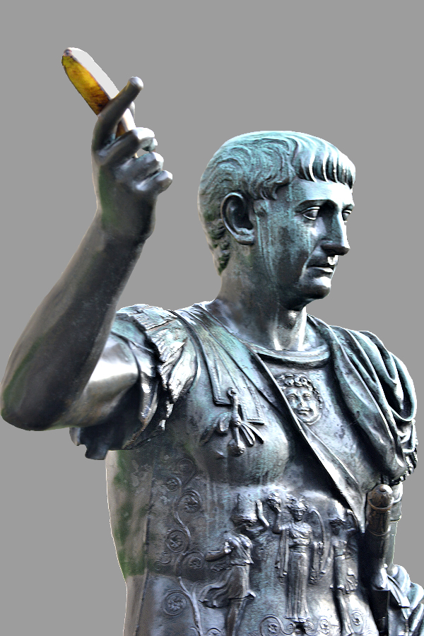 Man about Town: Statue of the Roman Emperor Trajan with an artfully placed banana sceptre, by the ruins of the Roman wall of Londinium at Tower Hill.