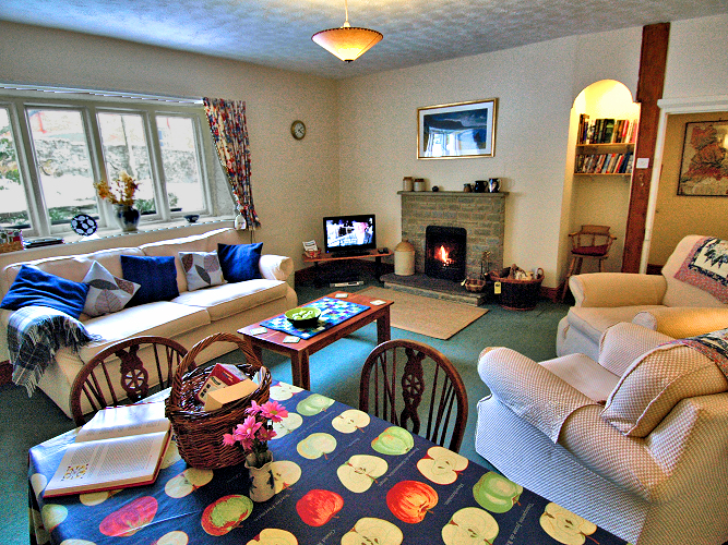 Clyro by Hay-on-Wye: Crows Nest Cottage's living-dining room with working fireplace. Photo copyright Home At First. Clyro by Hay-on-Wye: Crows Nest Cottage's living-dining room with working fireplace. Photo copyright Home At First.
