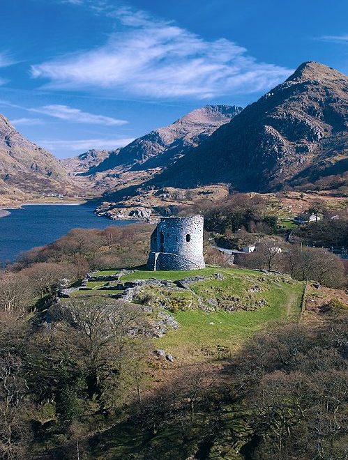 NORTHWEST WALES: DOLBADARN CASTLE, LLYN PERIS LAKE, LLANBERIS PASS, & MT. SNOWDON. Photo © Hawlfraint y Goron / © Crown copyright (2019) Cymru Wales. NW Wales: Dolbadarn Castle, Llanberis Pass, & Mt. Snowdon. Photo © Hawlfraint y Goron / © Crown copyright (2019) Cymru Wales.