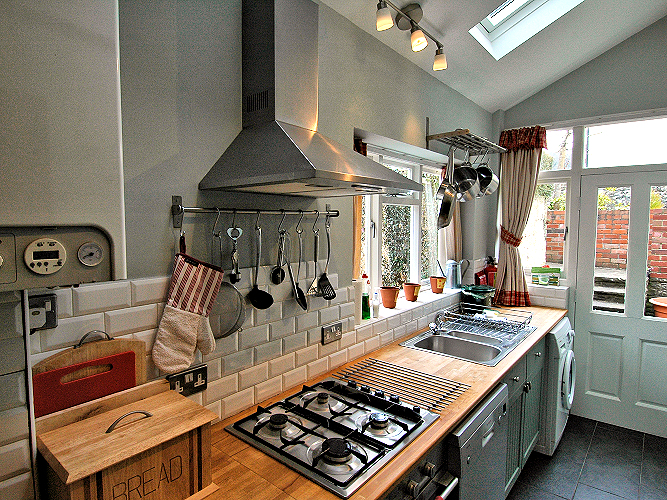 Llangattock: Usk Valley Townhouse - Kitchen with garden terrace access. Photo copyright Home At First. Llangattock: Usk Valley Townhouse - Kitchen with garden terrace access. Photo copyright Home At First.