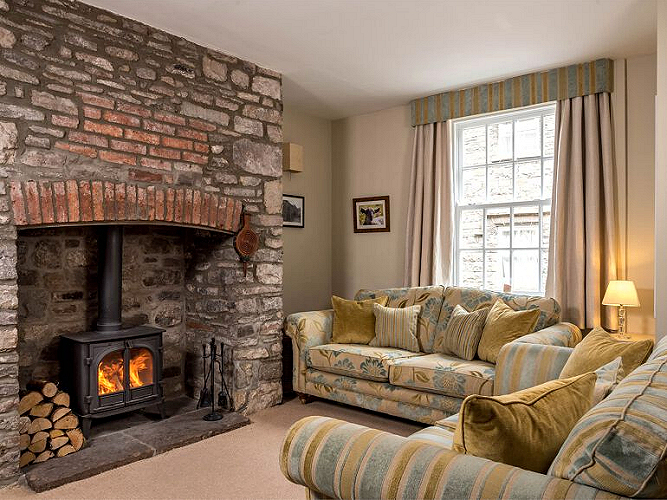 The Usk Valley Townhouse features a comfortably furnished living room with working fireplace and large flat-screen TV (not shown). Photo courtesy the owners. The Usk Valley Townhouse features a comfortably furnished living room with working fireplace and large flat-screen TV (not shown). Photo courtesy the owners.