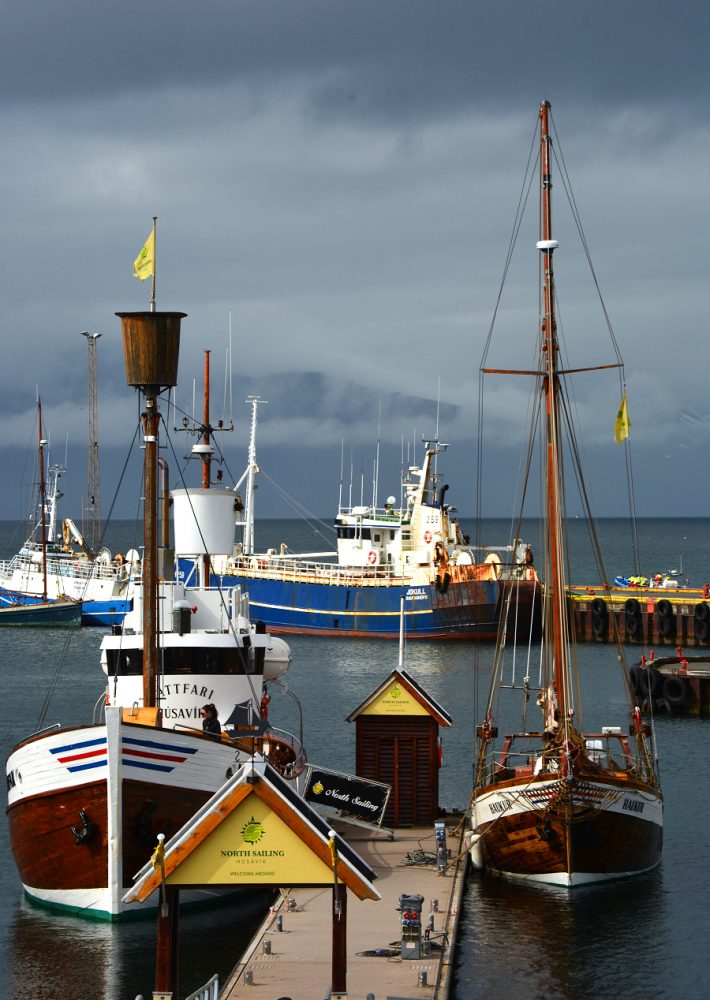 Iceland: boats in Husavik harbor. Photo © Home At First.