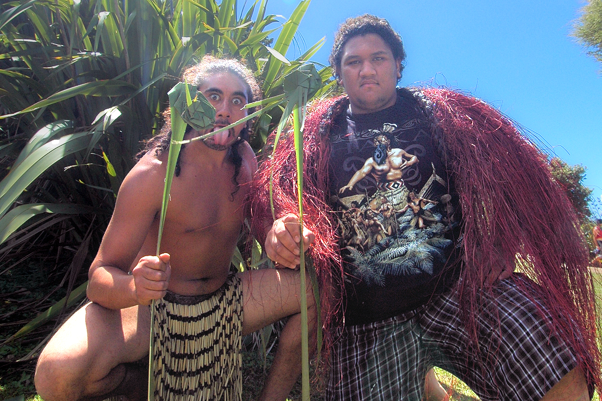 North Island: Young Maori men teach flax weaving at Waitangi. Photo © Home At First.