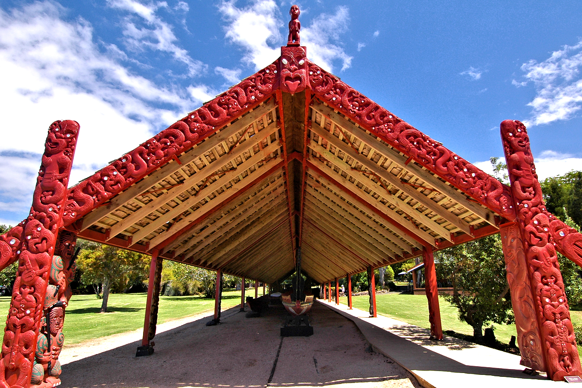 Northland: Waitangi - carved ceremonial shed covers the waka war canoe. Photo © Home At First.