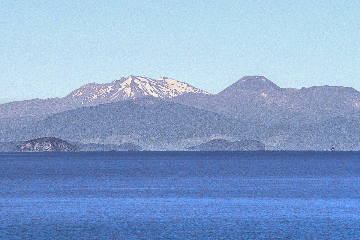 North Island: Taupo Region — Lake Taupo with volcanoes. Photo © Home At First.