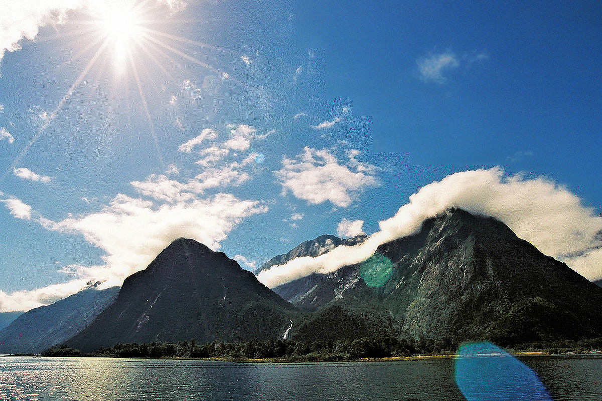 South Island: Fiordland - Sunburst on Milford Sound. Photo © Home At First.