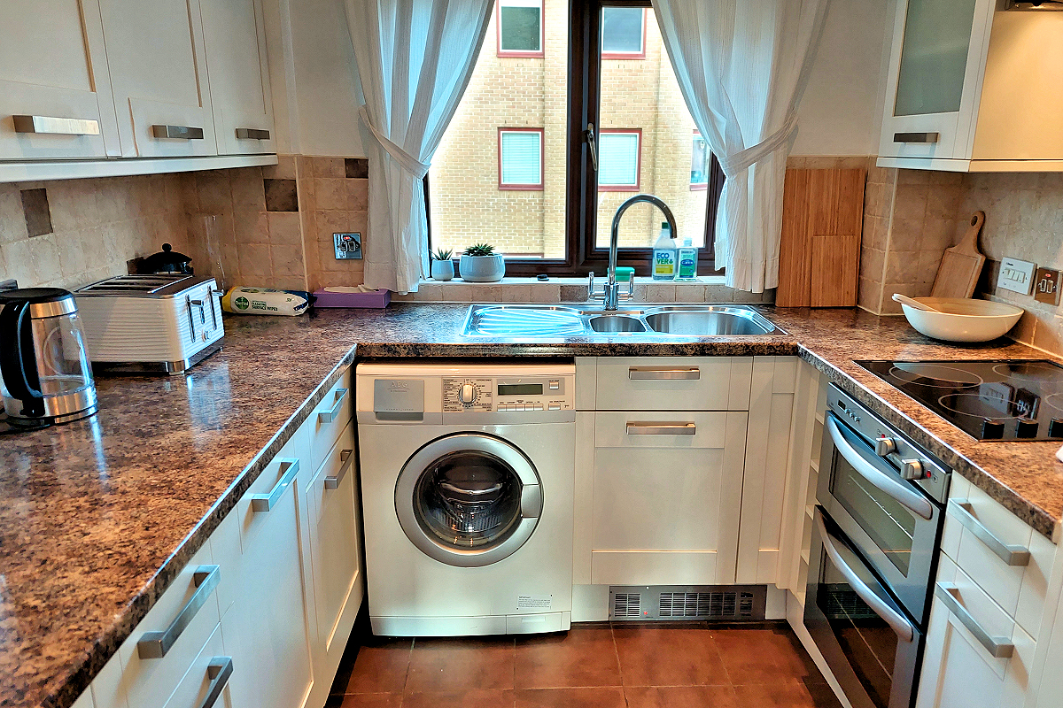 London: Tower Hamlets, Wapping — Docklands New Flat - Kitchen w. washer. Photo © Home At First.
