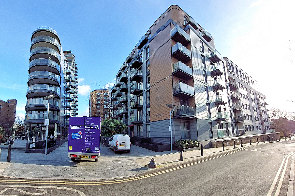 London: Tower Hamlets, Wapping — Tobacco Dock Apartments on Wapping Lane showing bus stop. Photo © Home At First.