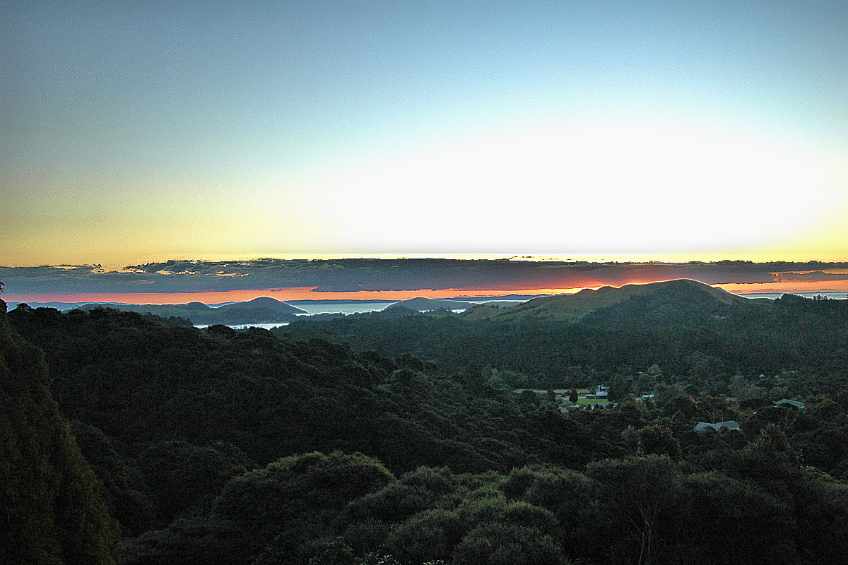 Coromandel: Hauraki Bay sunset from Treehouse Inn. Photo © Home At First.
