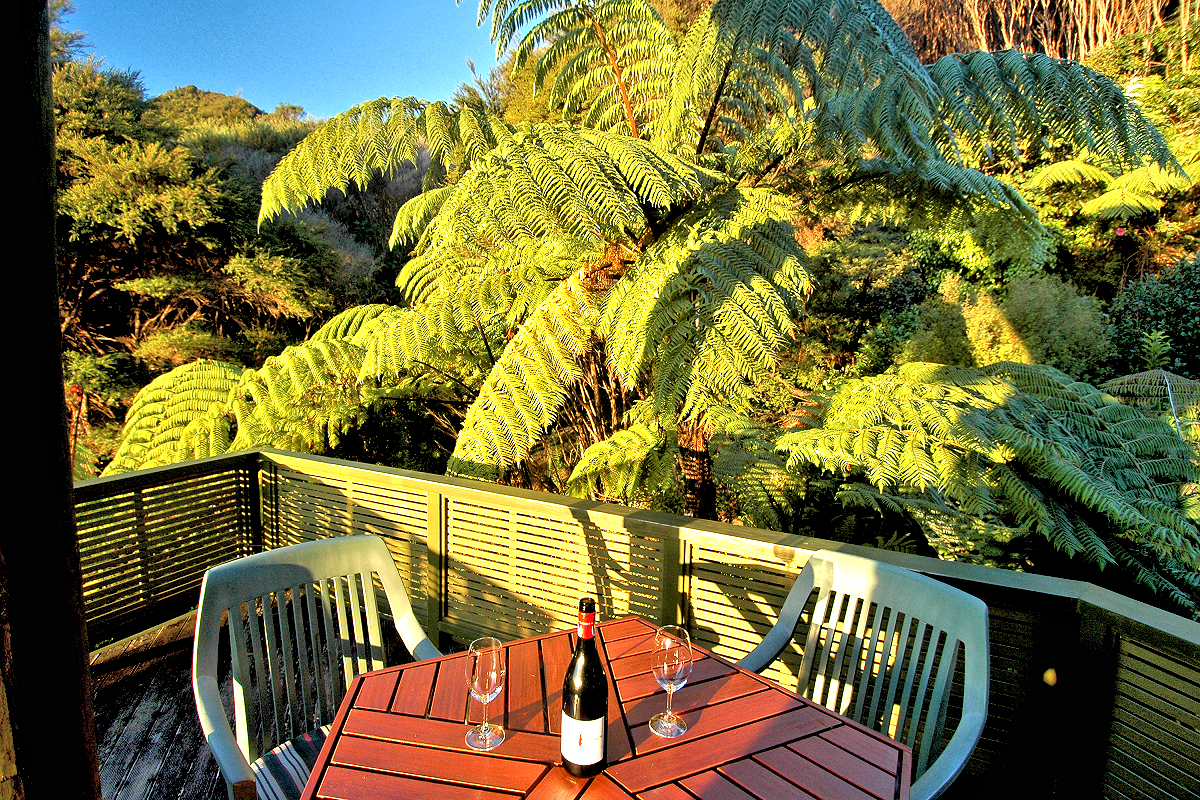 Coromandel: Treehouse Inn — wine on the terrace. Photo © Home At First.