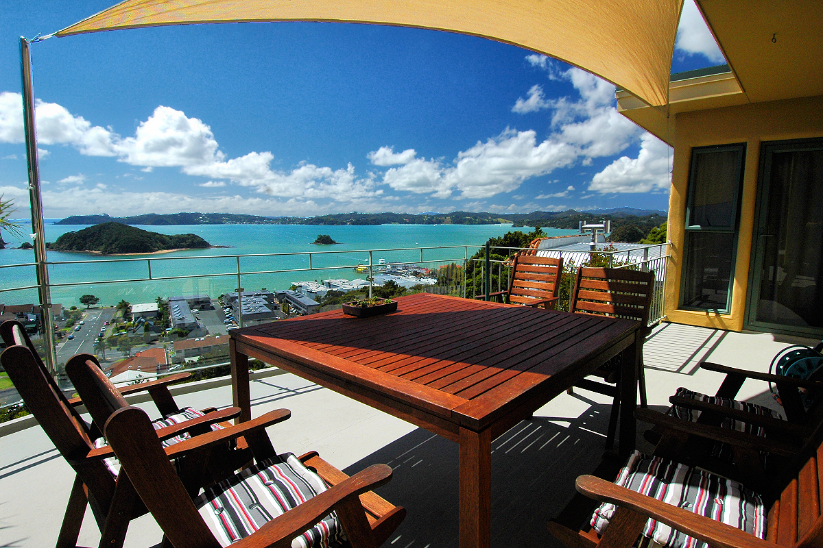 Northland: Furnished Deck with Bay of Islands view. Photo © Home At First, creators of Independent Fly/Drive New Zealand Travel.